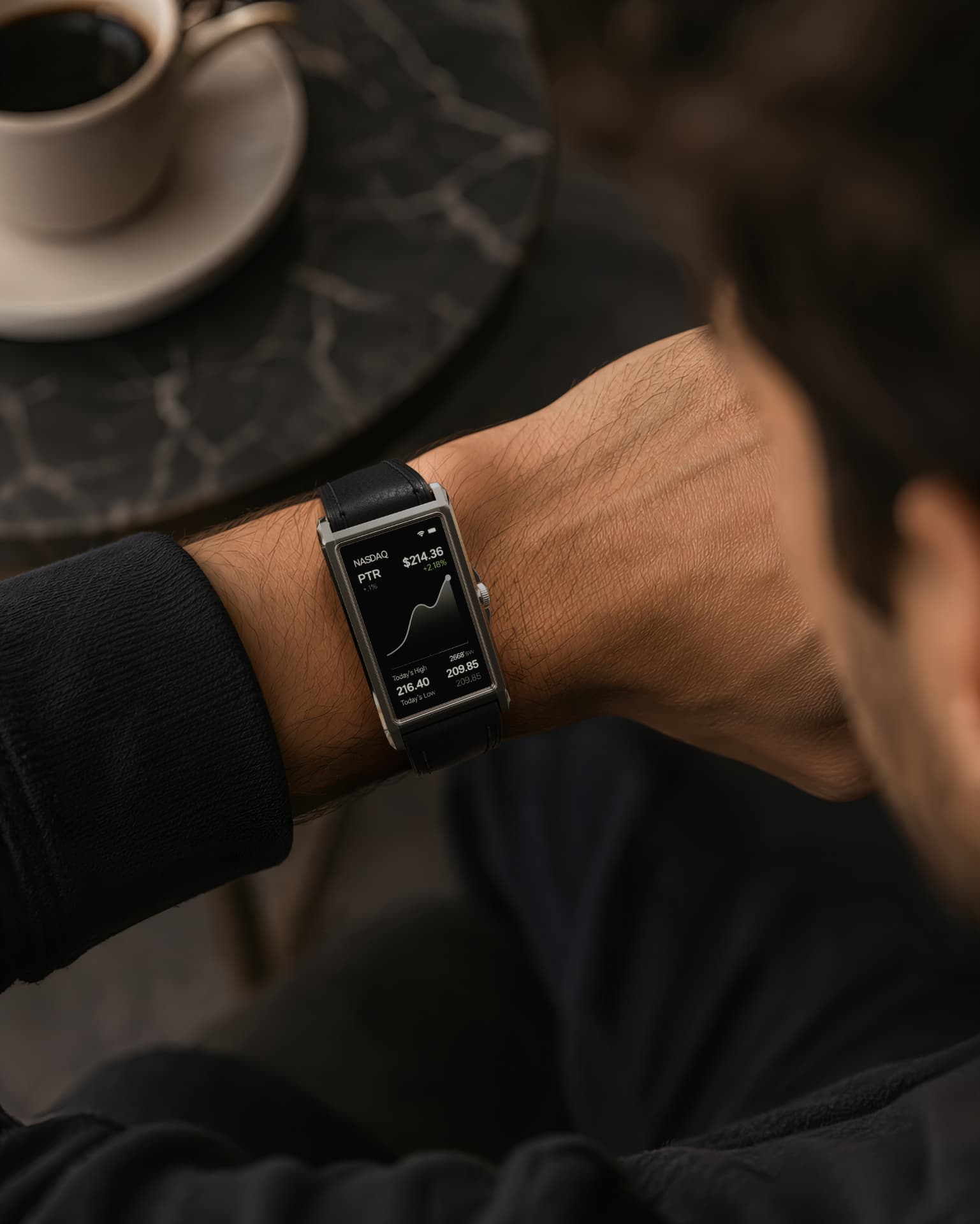The Panther Solstice on wrist at a cafe showing stock market data and notifications